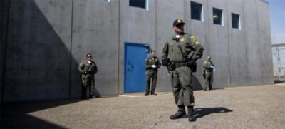 Four correctional officers standing outside